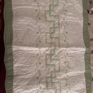 Green and White Embroidered Quilt